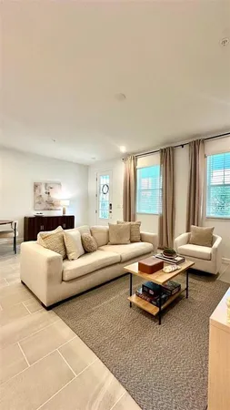 a living room with furniture and a window