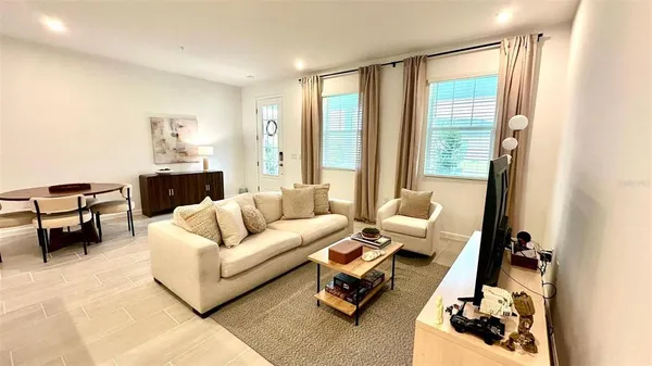 a living room with furniture and a large window