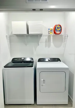 a utility room with dryer and washer