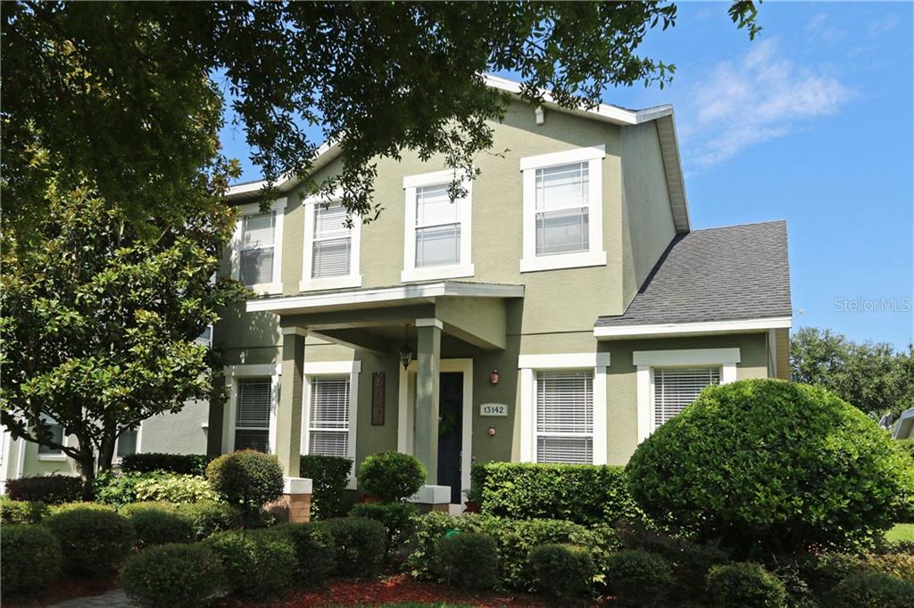 13142 Sunkiss Loop Windermere, FL 34786 - Photo 1 of 1 a front view of a house with a yard