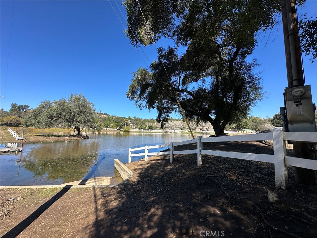 2005 Corte Asoleado Alpine, CA 91901 - Photo 18 of 22 a wooden bench sitting next to a lake