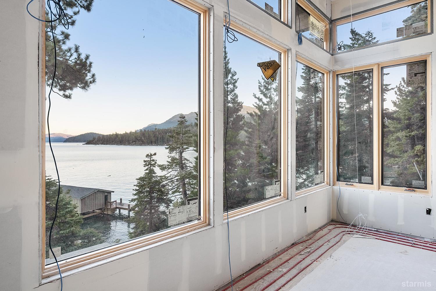 255 Drum Road Meeks Bay, CA 96142 - Photo 16 of 19 a view of a room that has a large window and front door