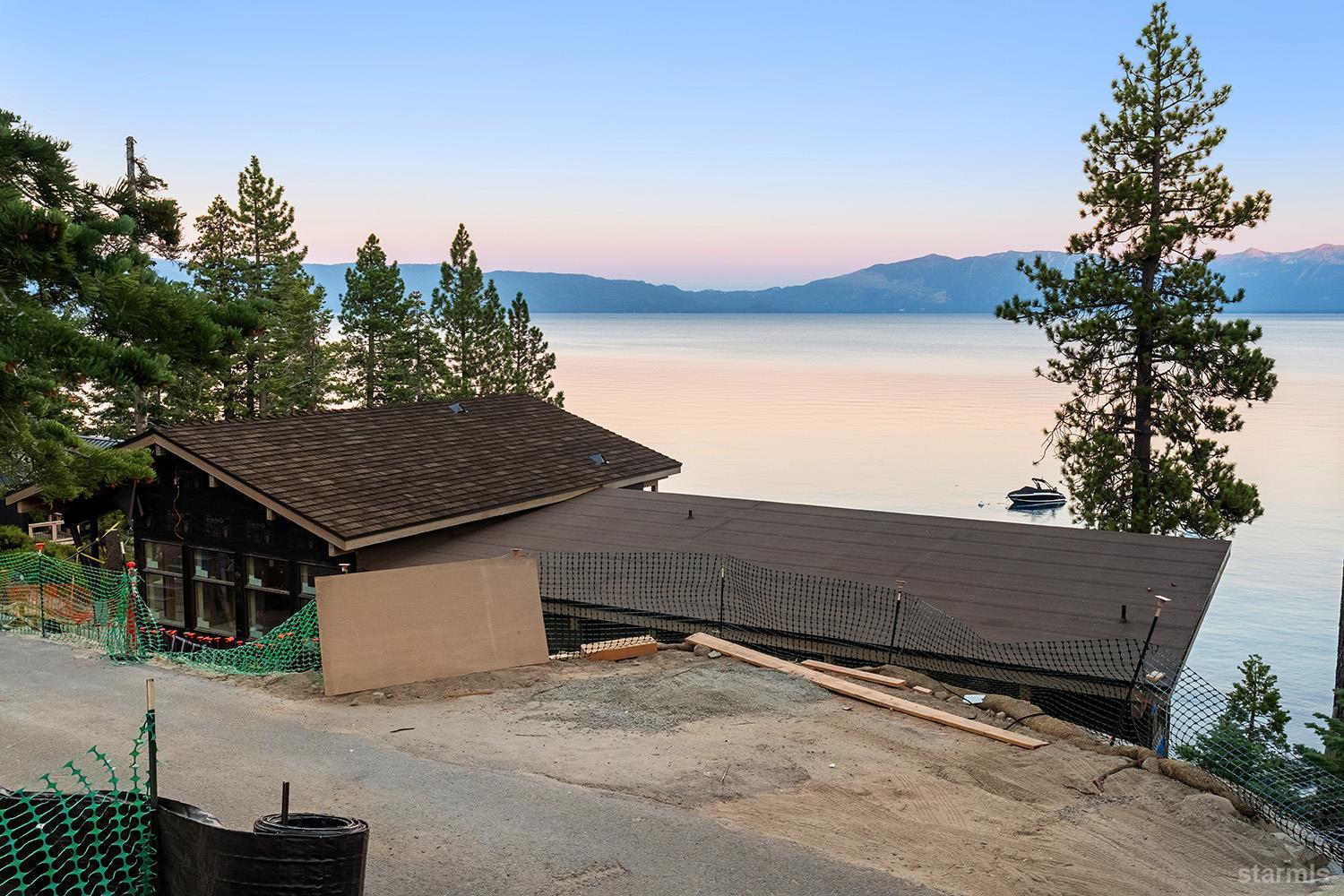 255 Drum Road Meeks Bay, CA 96142 - Photo 2 of 19 a backyard of a house with lots of green space