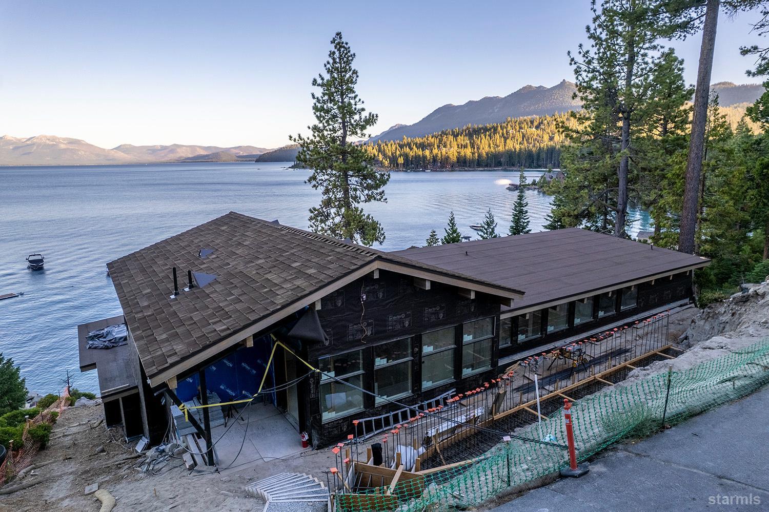 255 Drum Road Meeks Bay, CA 96142 - Photo 6 of 19 a aerial view of a house with a table and chairs