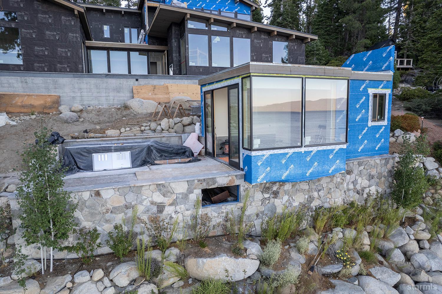 255 Drum Road Meeks Bay, CA 96142 - Photo 7 of 19 a view of a house with backyard and sitting area