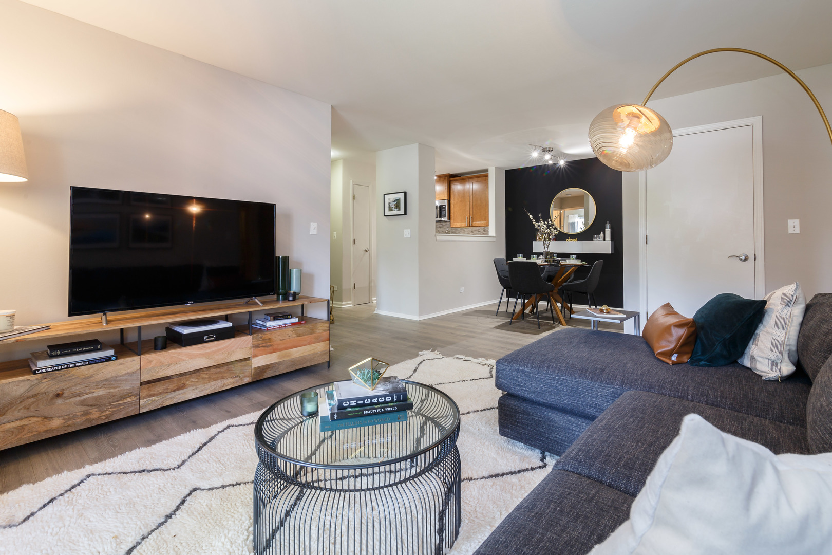 93 Aster Drive, Unit 3423 Schaumburg, IL 60173 - Photo 15 of 26 a living room with furniture and a flat screen tv