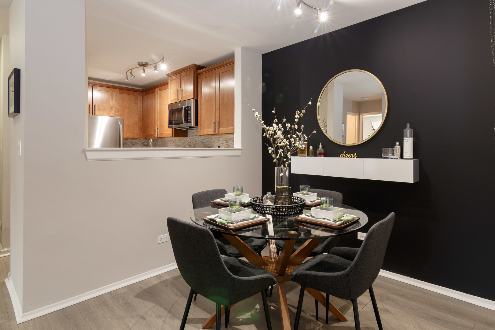 93 Aster Drive, Unit 3423 Schaumburg, IL 60173 - Photo 7 of 26 a dining room with furniture and a mirror
