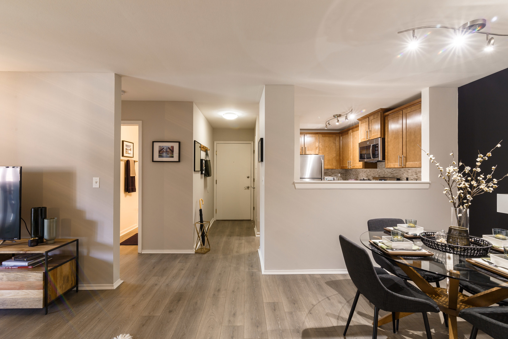93 Aster Drive, Unit 3423 Schaumburg, IL 60173 - Photo 10 of 26 a view of a dining room with furniture and wooden floor
