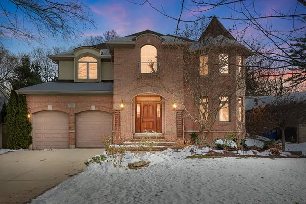 a front view of a house with parking