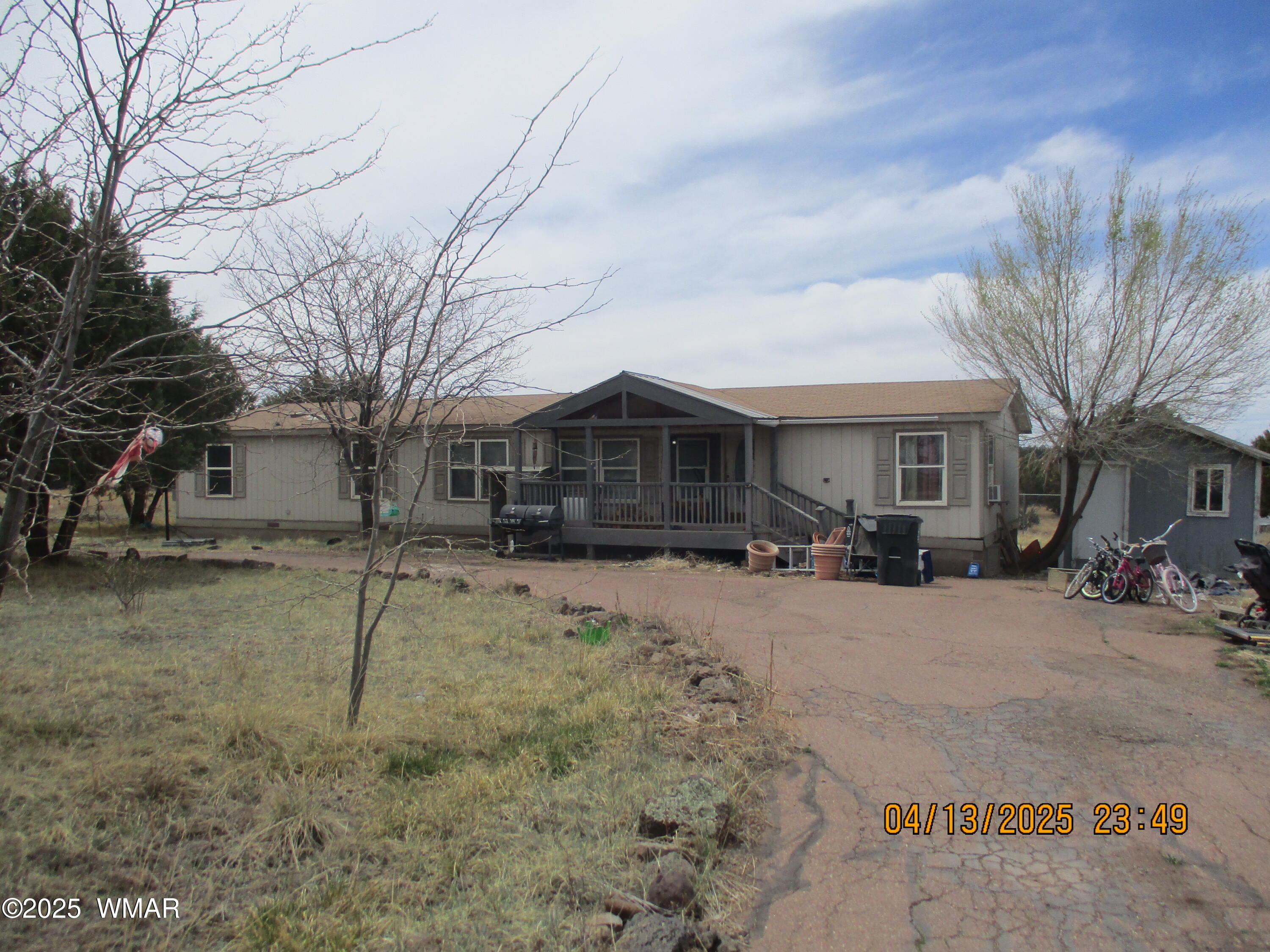 2312 Parkinson Road Lakeside, AZ 85929 - Photo 1 of 1 a view of a house with a snow in a yard