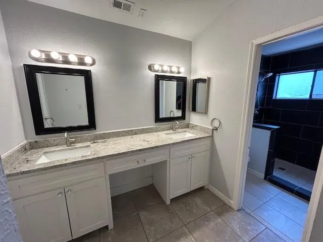 a bathroom with a toilet a sink and a shower