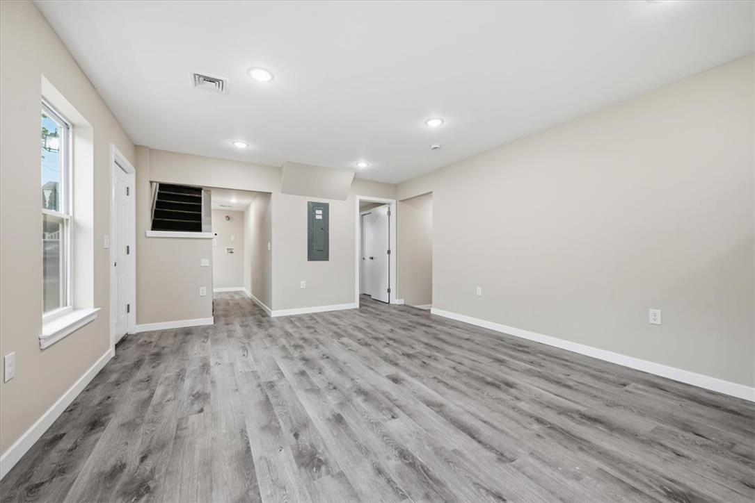 5641 North Coplay Road Whitehall, PA 18052 - Photo 15 of 68 A versatile open-concept living space features durable plank flooring and ample natural light.