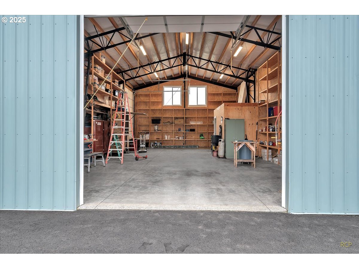 31001 Northwest 51st Avenue Ridgefield, WA 98642 - Photo 12 of 48 a view of a room with lots of furniture and a window