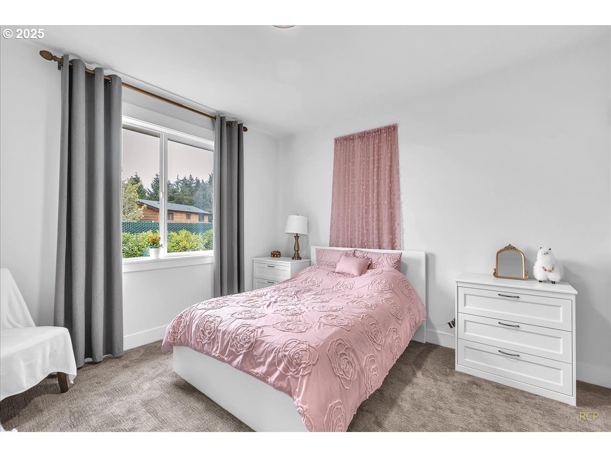 31001 Northwest 51st Avenue Ridgefield, WA 98642 - Photo 28 of 48 a bedroom with a bed and a dresser