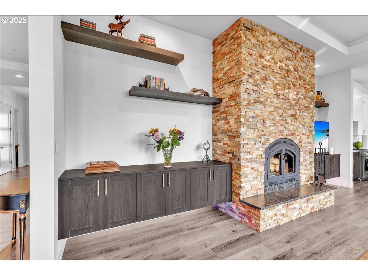 31001 Northwest 51st Avenue Ridgefield, WA 98642 - Photo 35 of 48 a living room with furniture and a fireplace