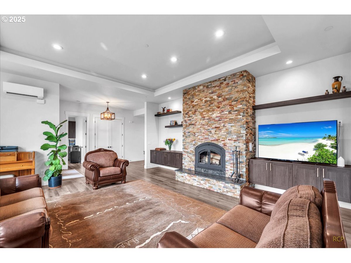 31001 Northwest 51st Avenue Ridgefield, WA 98642 - Photo 39 of 48 a living room with furniture and a fireplace