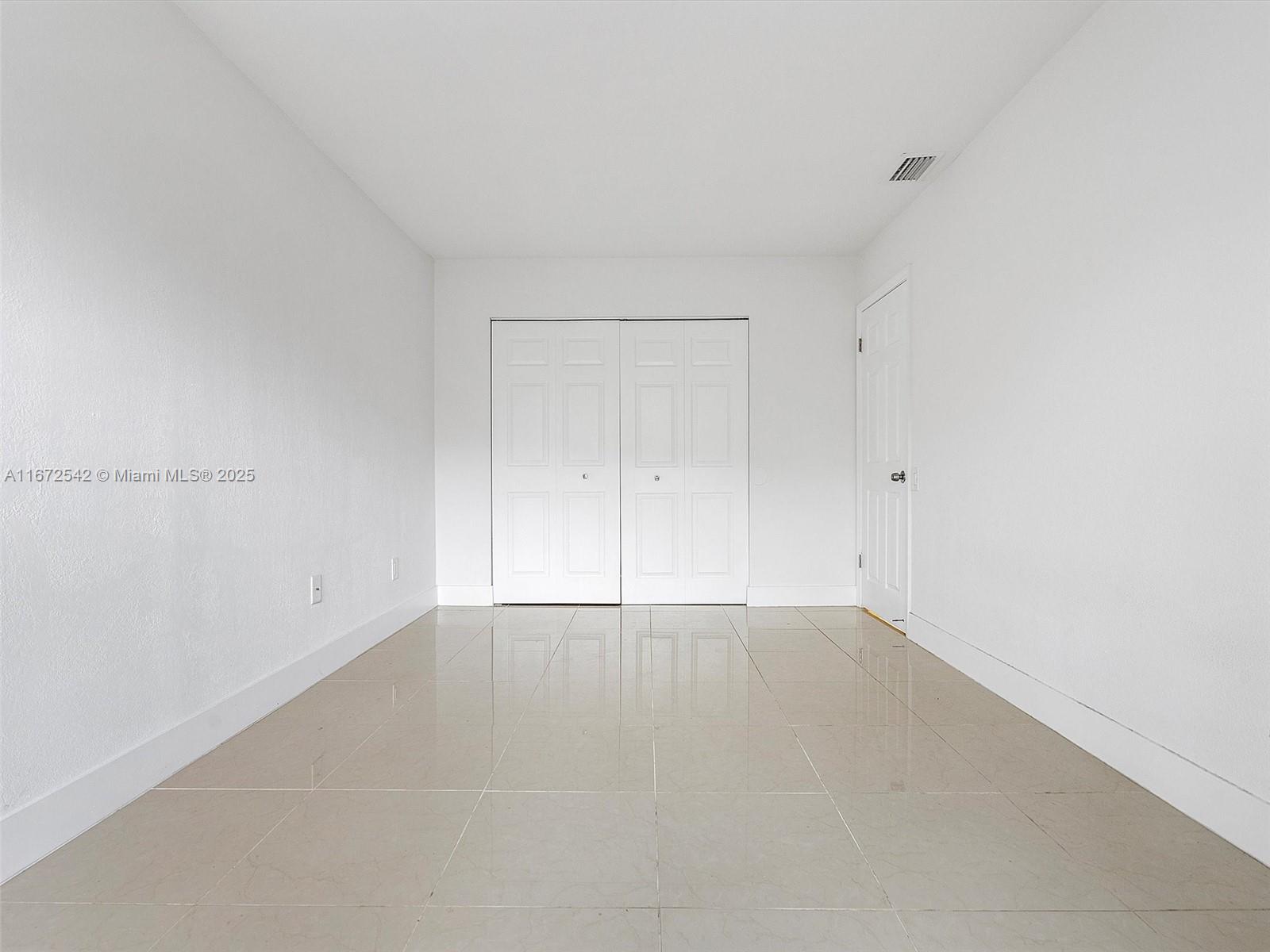 6604 Southwest 114th Place, Unit F72 Miami, FL 33173 - Photo 14 of 25 a view of an empty room