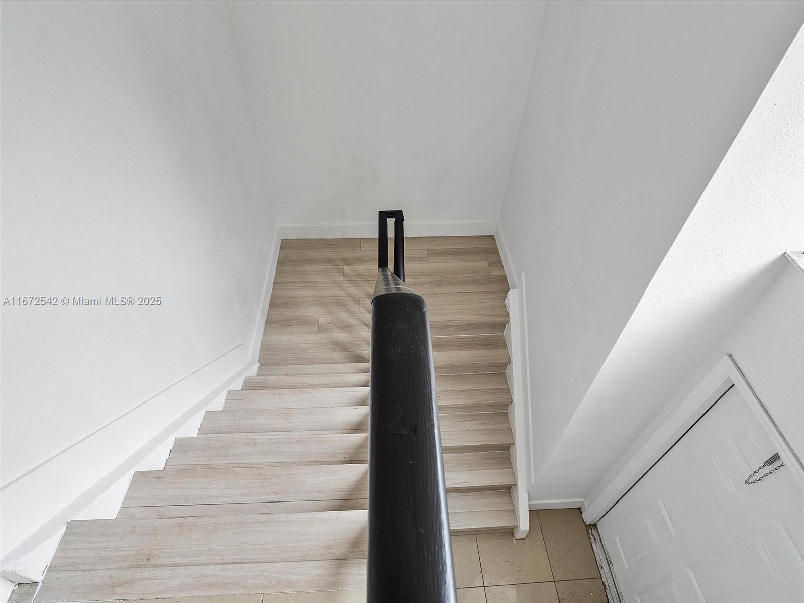 6604 Southwest 114th Place, Unit F72 Miami, FL 33173 - Photo 16 of 25 a view of entryway with wooden floor