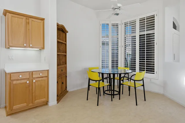 an empty room with windows and mountain view