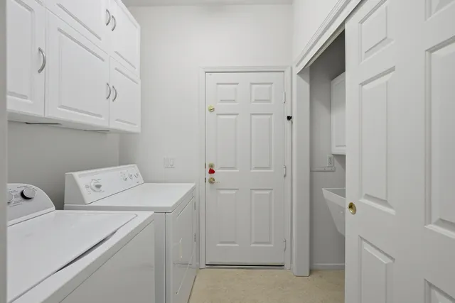 a view of a patio with table and chairs and potted plants