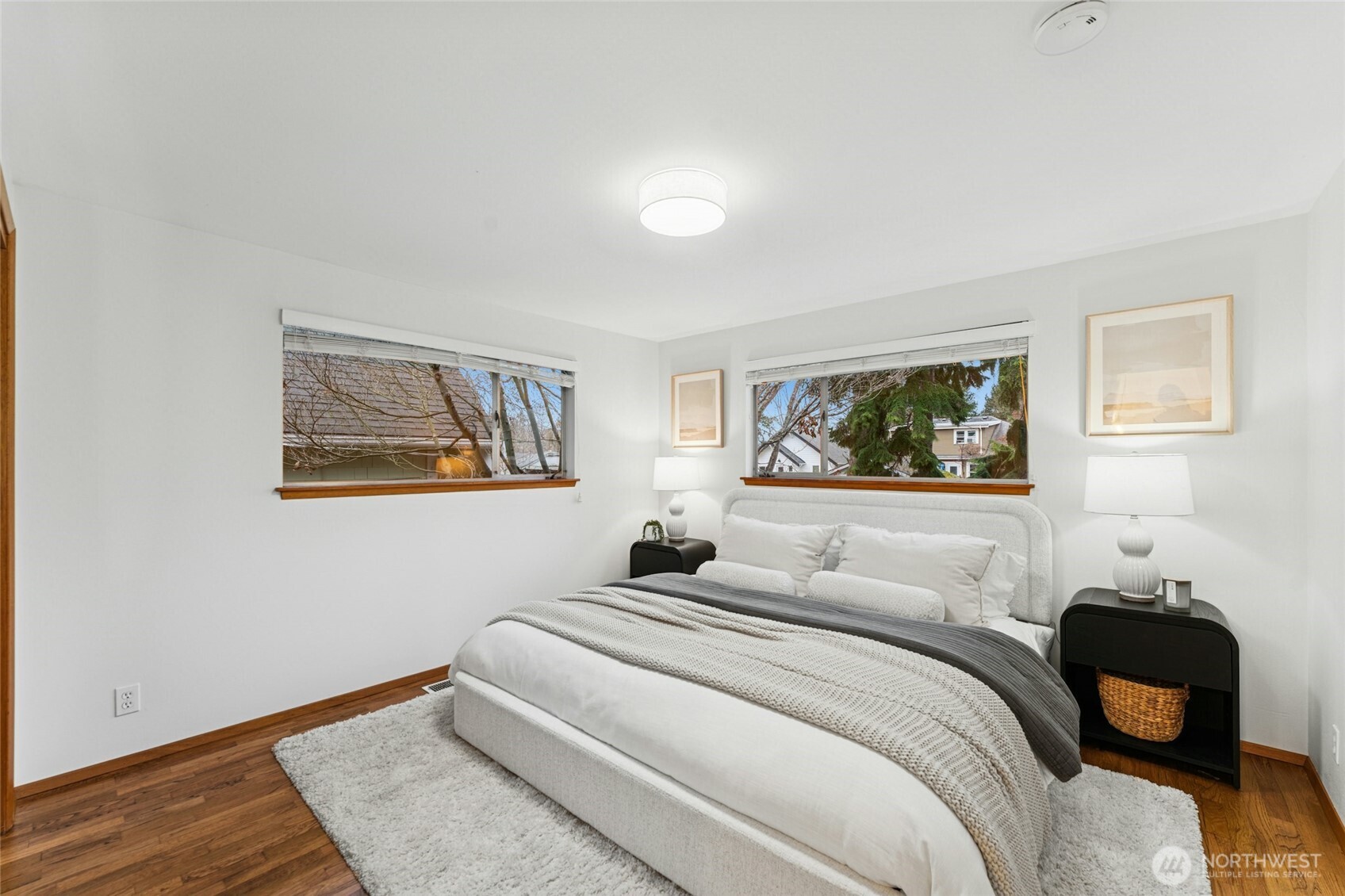 3209 61st Avenue Southwest Seattle, WA 98116 - Photo 14 of 32 a bedroom with a bed and a lamp on desk