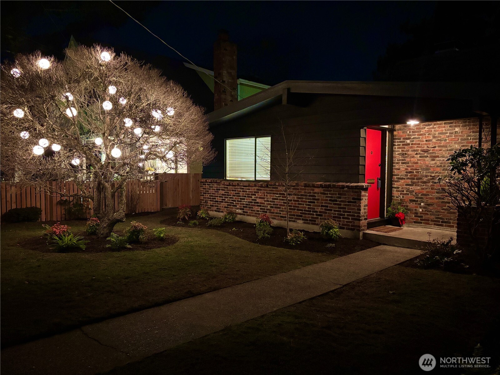 3209 61st Avenue Southwest Seattle, WA 98116 - Photo 32 of 32 a front view of a house with a yard