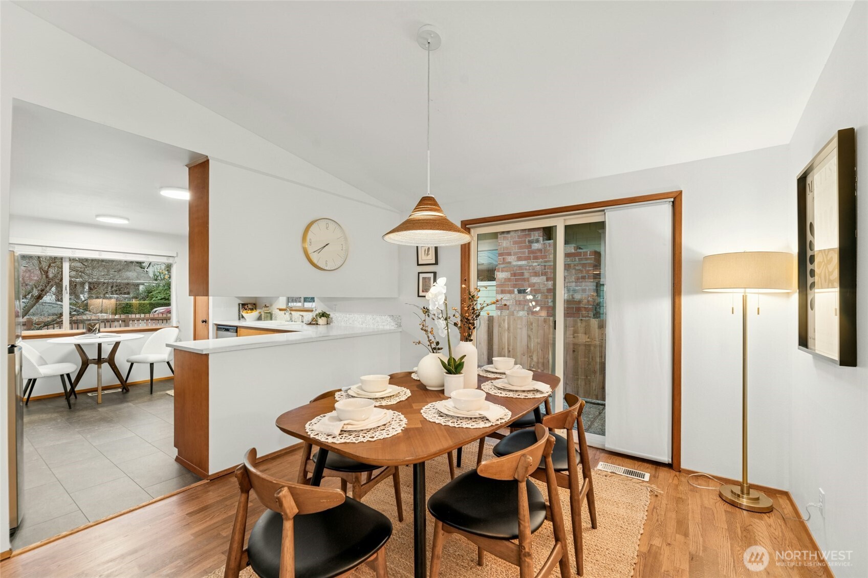 3209 61st Avenue Southwest Seattle, WA 98116 - Photo 7 of 32 a view of a dining room with furniture and wooden floor