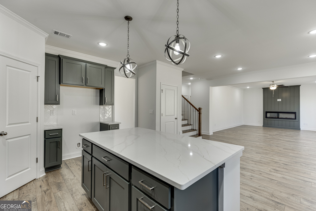 1003 Lakeview Drive Commerce, GA 30529 - Photo 11 of 48 a kitchen with stainless steel appliances a kitchen island a stove and a view of kitchen