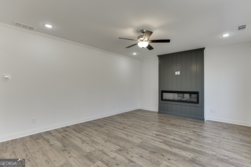 1003 Lakeview Drive Commerce, GA 30529 - Photo 16 of 48 a view of an empty room with a ceiling fan and window