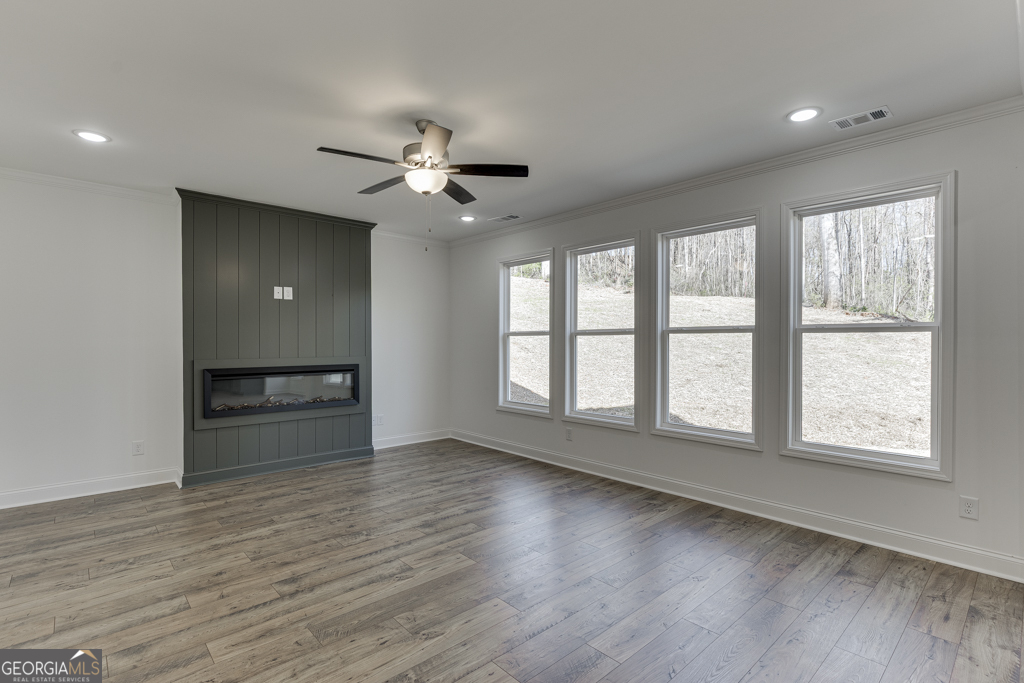 1003 Lakeview Drive Commerce, GA 30529 - Photo 18 of 48 a view of an empty room with a window and wooden floor