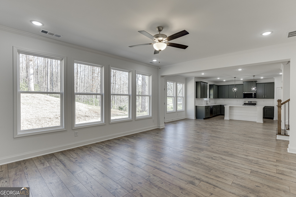 1003 Lakeview Drive Commerce, GA 30529 - Photo 19 of 48 a view of an empty room with wooden floor and a window