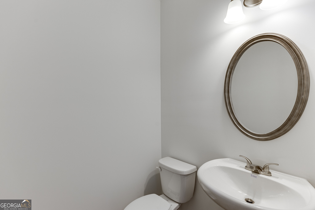 1003 Lakeview Drive Commerce, GA 30529 - Photo 21 of 48 a bathroom with a sink and a mirror