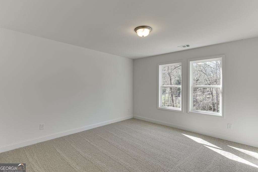 1003 Lakeview Drive Commerce, GA 30529 - Photo 23 of 48 an empty room with a window