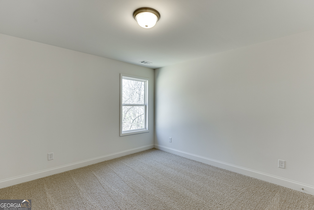 1003 Lakeview Drive Commerce, GA 30529 - Photo 25 of 48 an empty room with windows