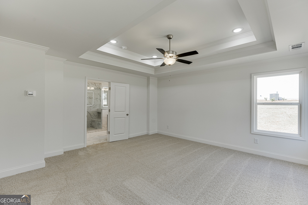1003 Lakeview Drive Commerce, GA 30529 - Photo 34 of 48 an empty room with chandelier fan and windows