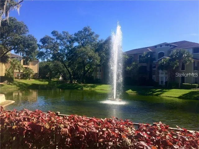 a view of a lake with a house in the background