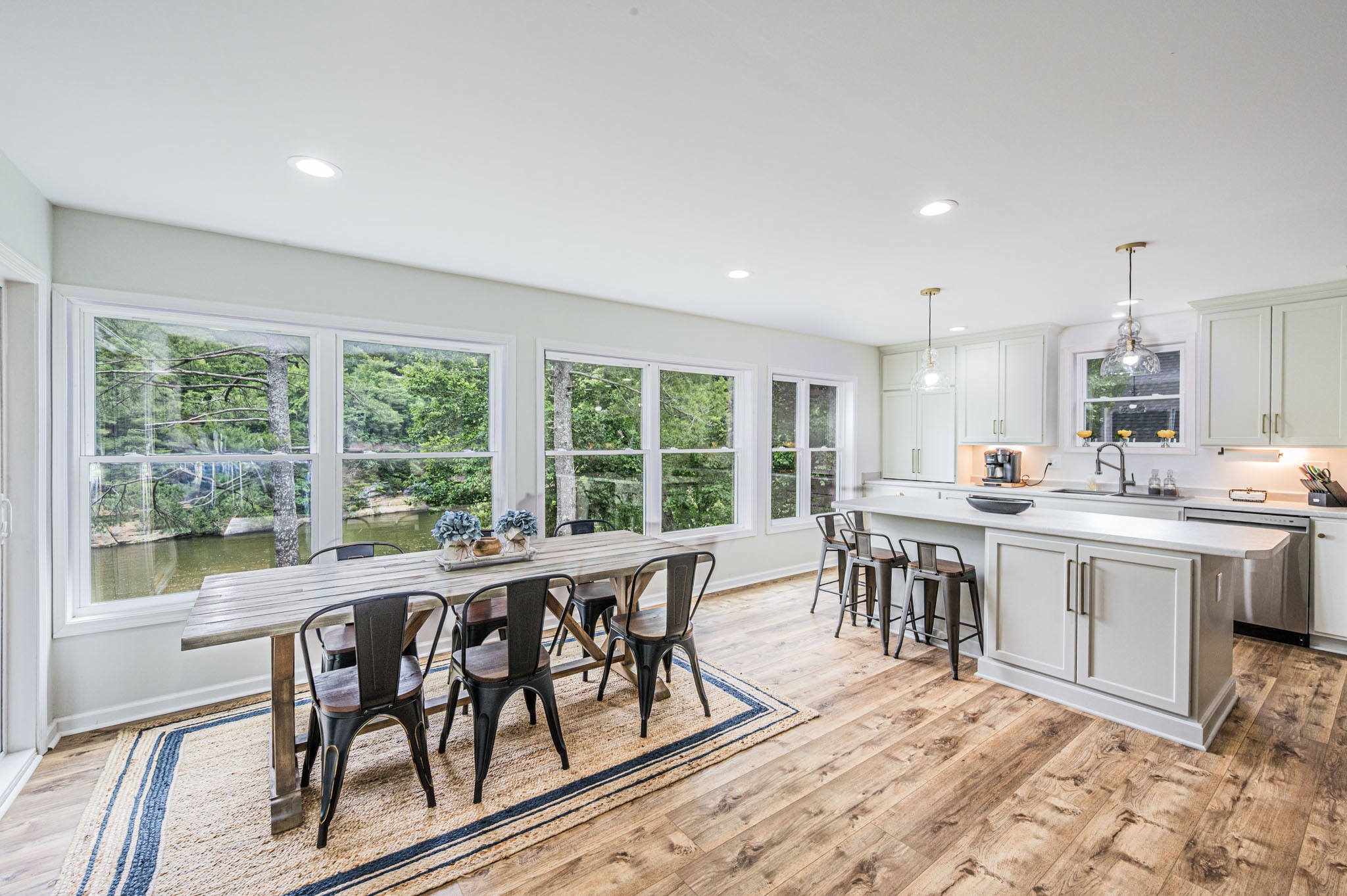 87 Angela Way Lewisburg, KY 42256 - Photo 13 of 39 a open dining room with stainless steel appliances granite countertop a stove a refrigerator a white table and chairs