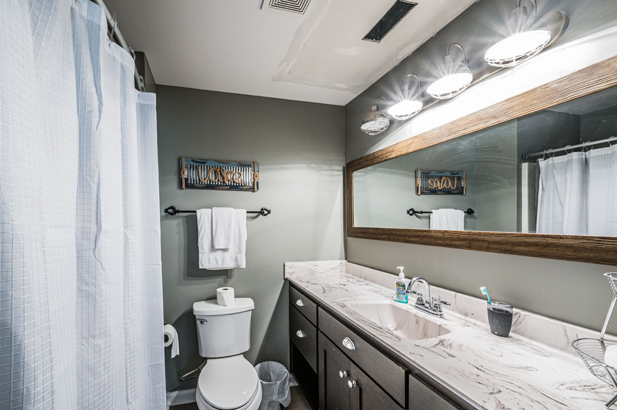 87 Angela Way Lewisburg, KY 42256 - Photo 25 of 39 a bathroom with a granite countertop toilet sink and mirror