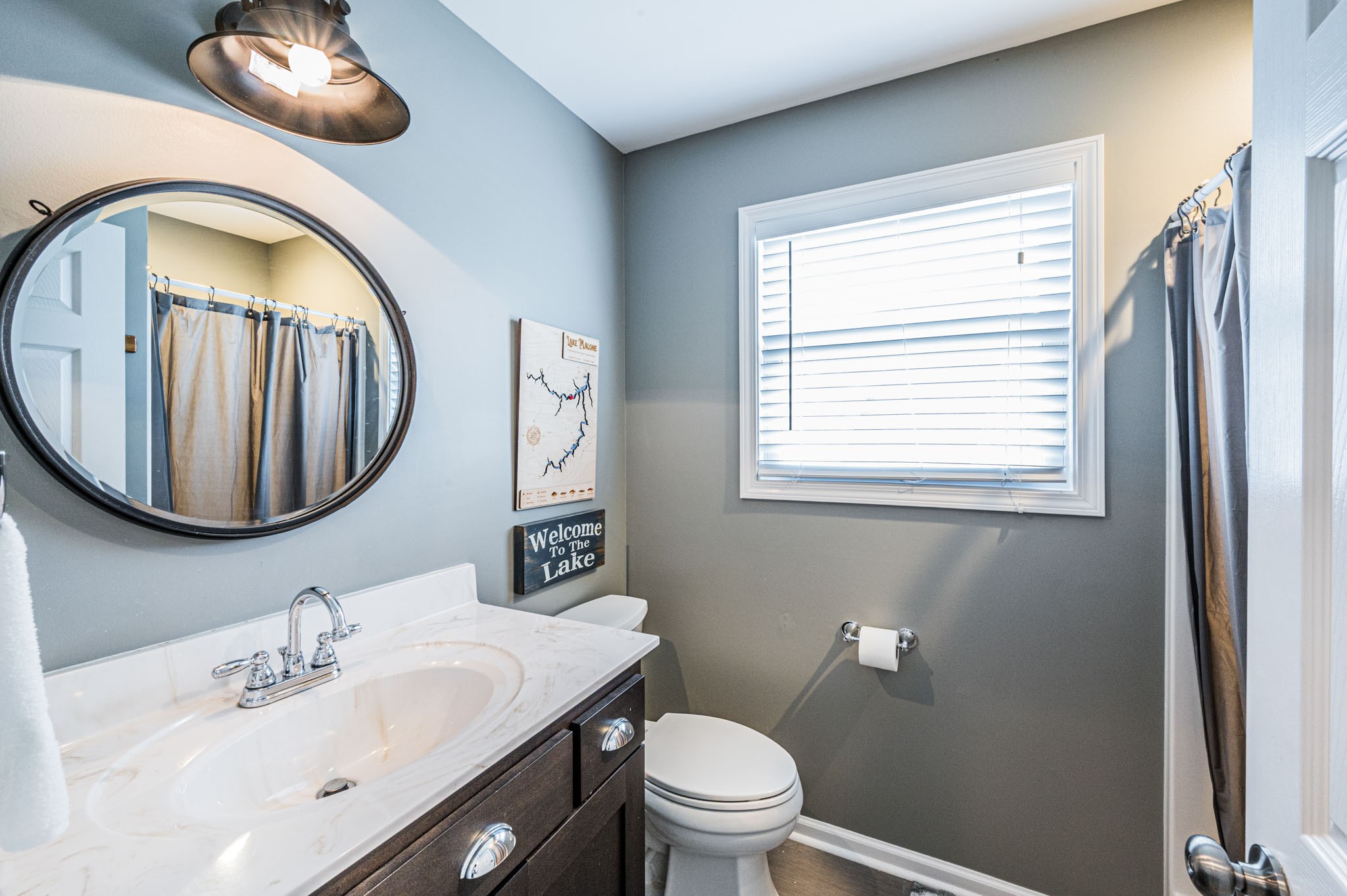 87 Angela Way Lewisburg, KY 42256 - Photo 10 of 39 a bathroom with a toilet a sink and a mirror