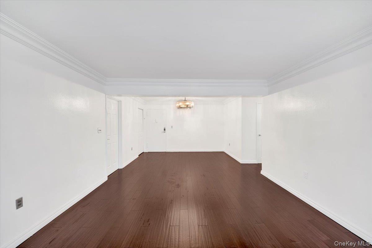 1 Balint Drive, Unit 366 Yonkers, NY 10710 - Photo 6 of 31 an empty room with wooden floor and windows