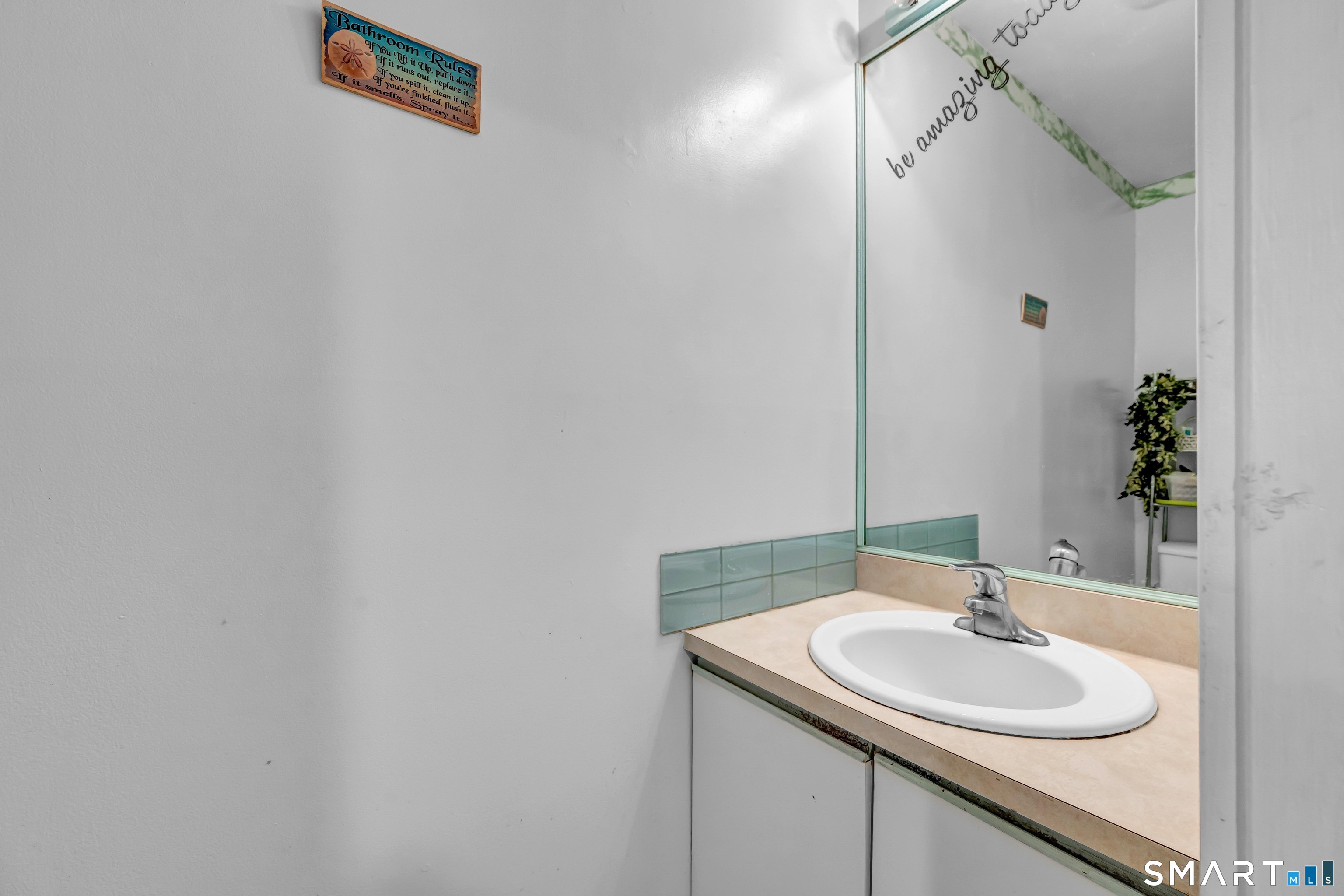 14 Newtown Road, Unit A5 Danbury, CT 06810 - Photo 15 of 27 a bathroom with a sink and a mirror