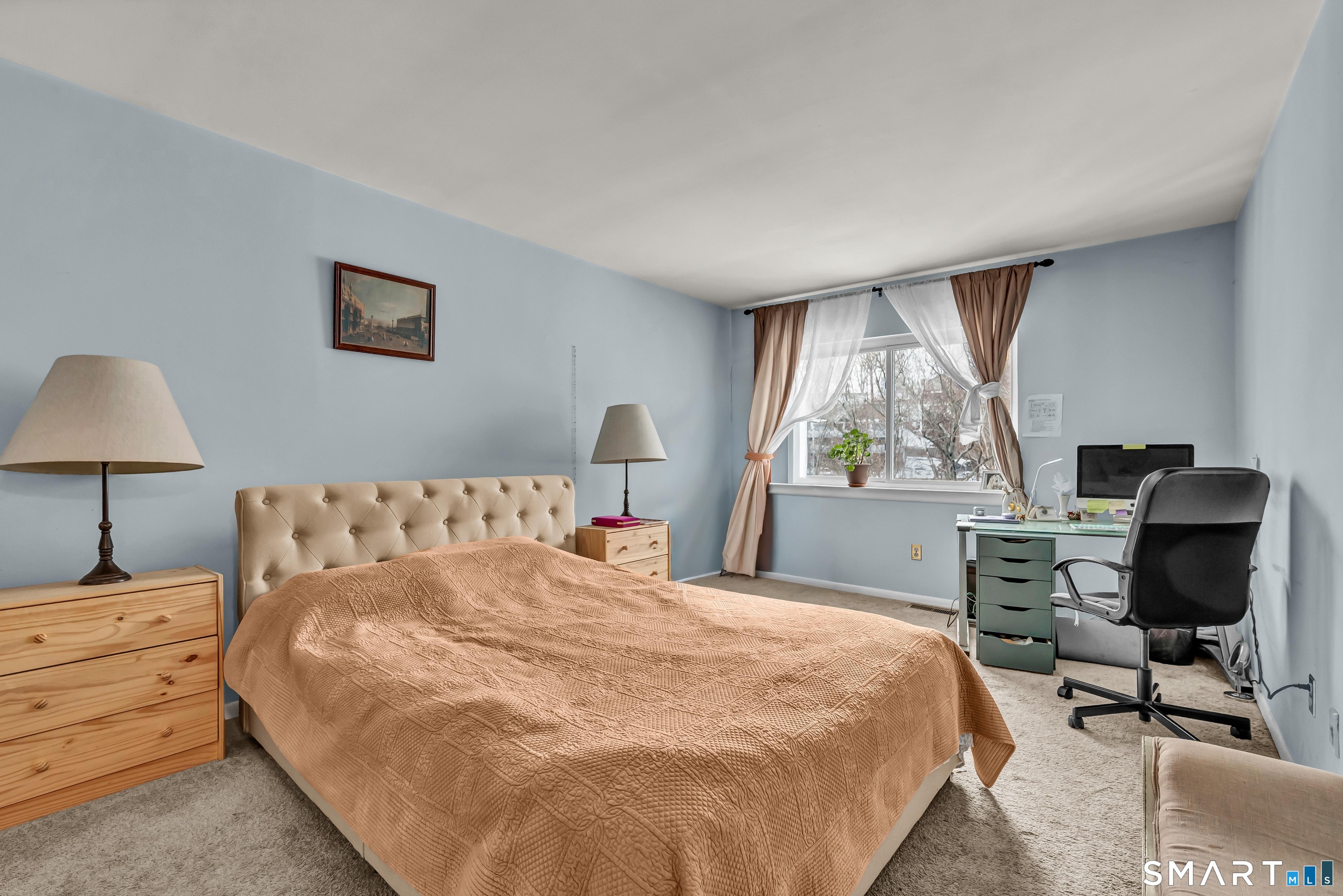 14 Newtown Road, Unit A5 Danbury, CT 06810 - Photo 17 of 27 a large bed sitting in a bedroom next to a window