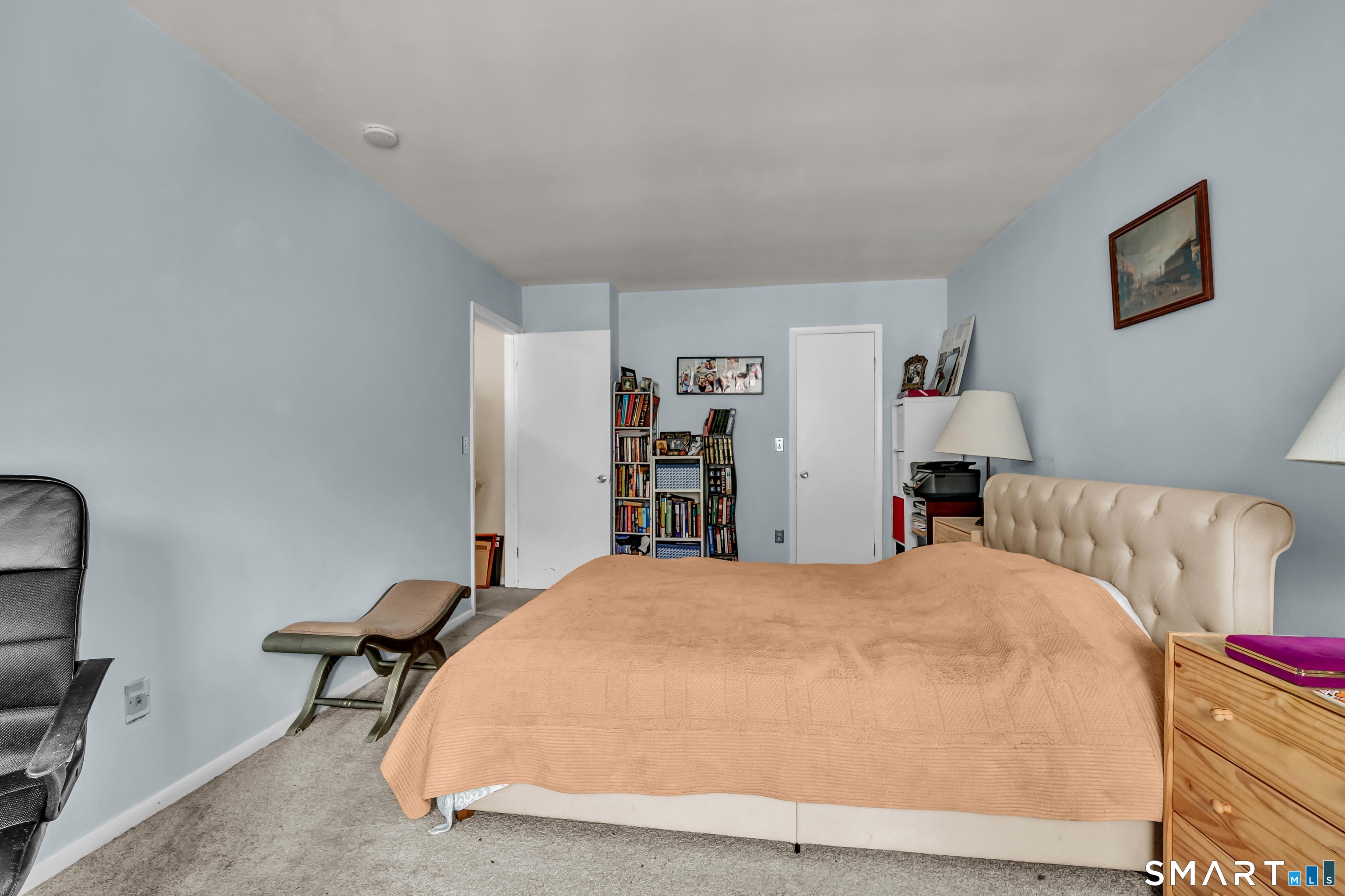 14 Newtown Road, Unit A5 Danbury, CT 06810 - Photo 18 of 27 a bed room with a bed and a chair