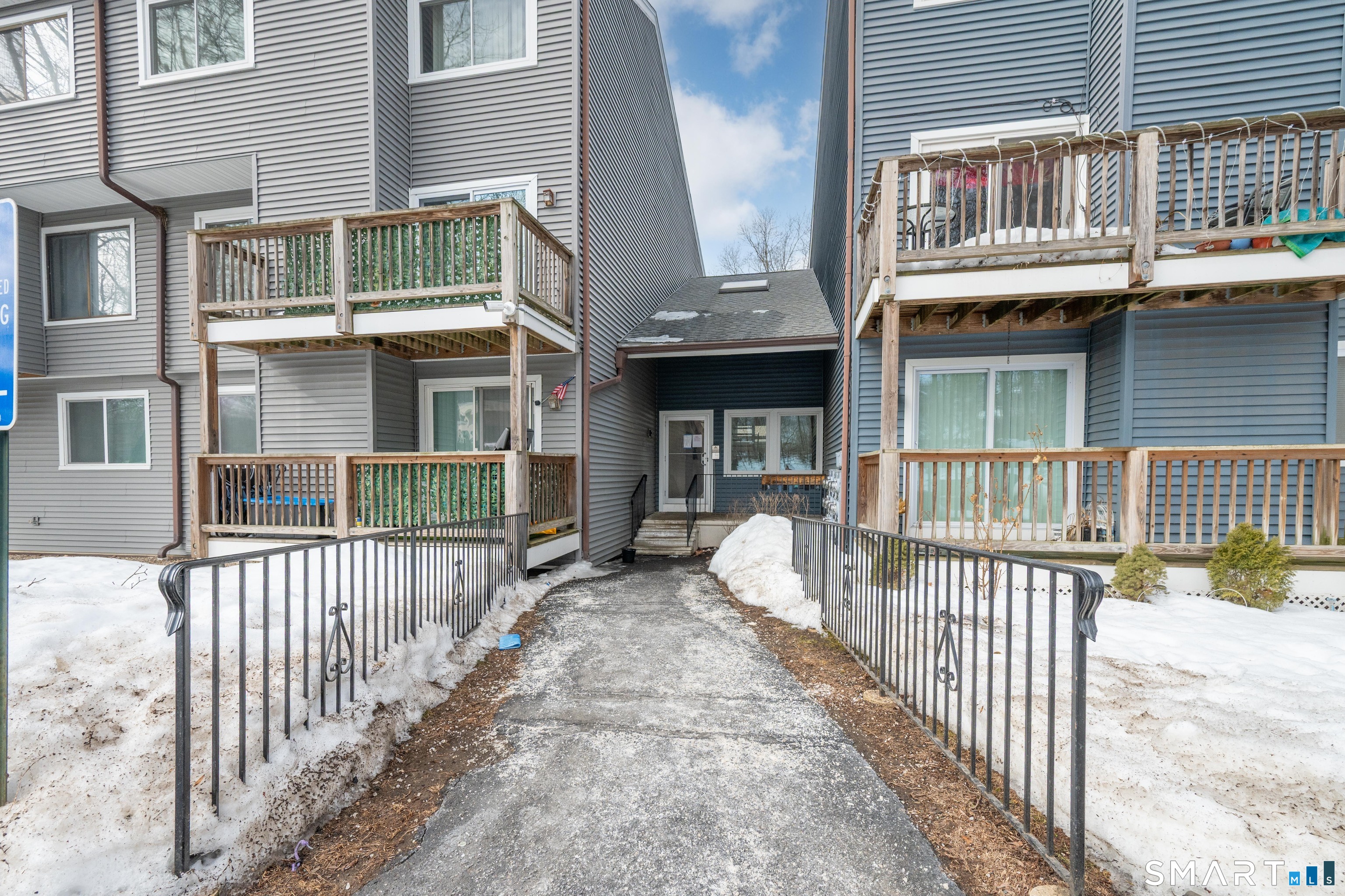 14 Newtown Road, Unit A5 Danbury, CT 06810 - Photo 2 of 27 a front view of a house with a porch