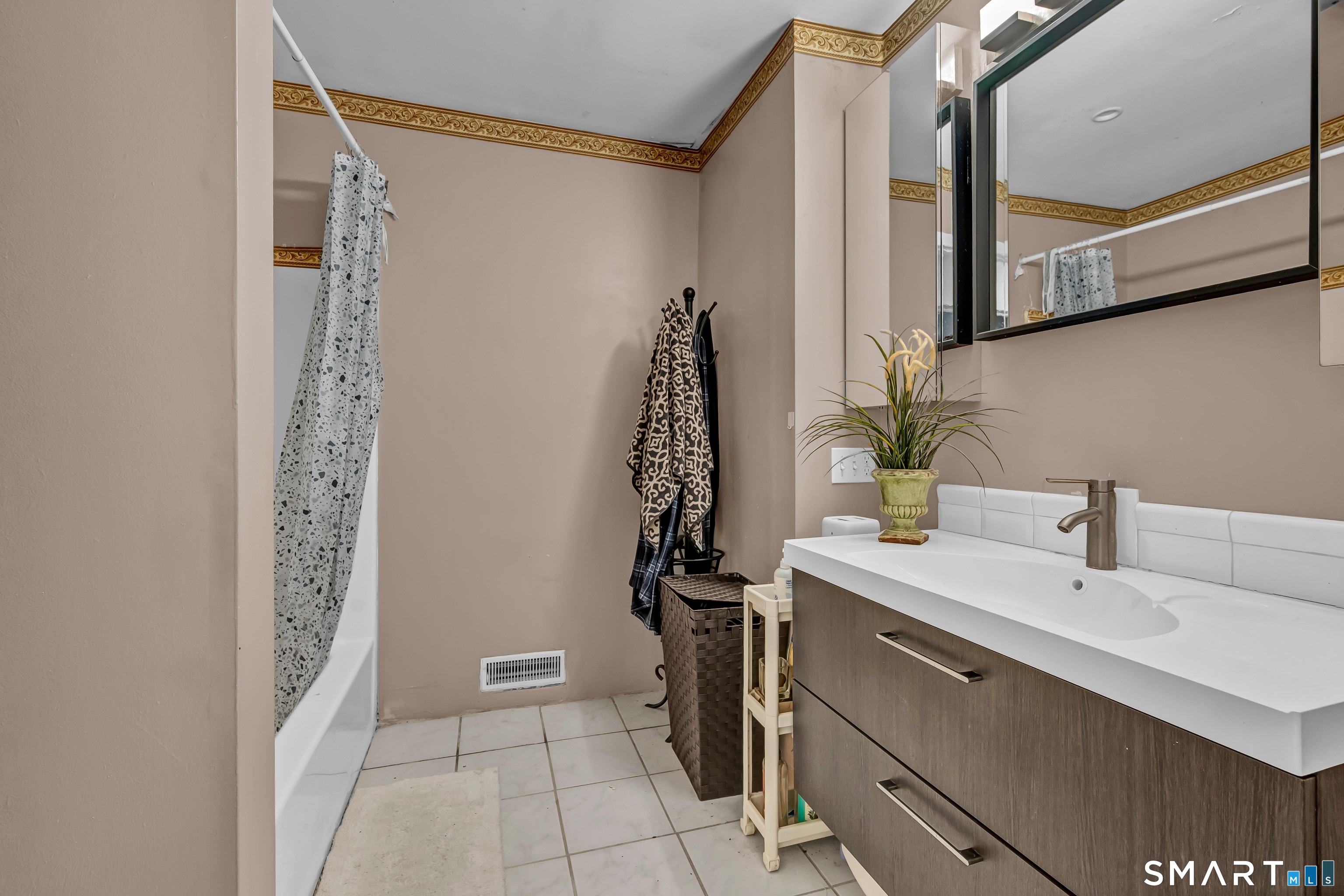 14 Newtown Road, Unit A5 Danbury, CT 06810 - Photo 21 of 27 a bathroom with a sink a mirror and a shower