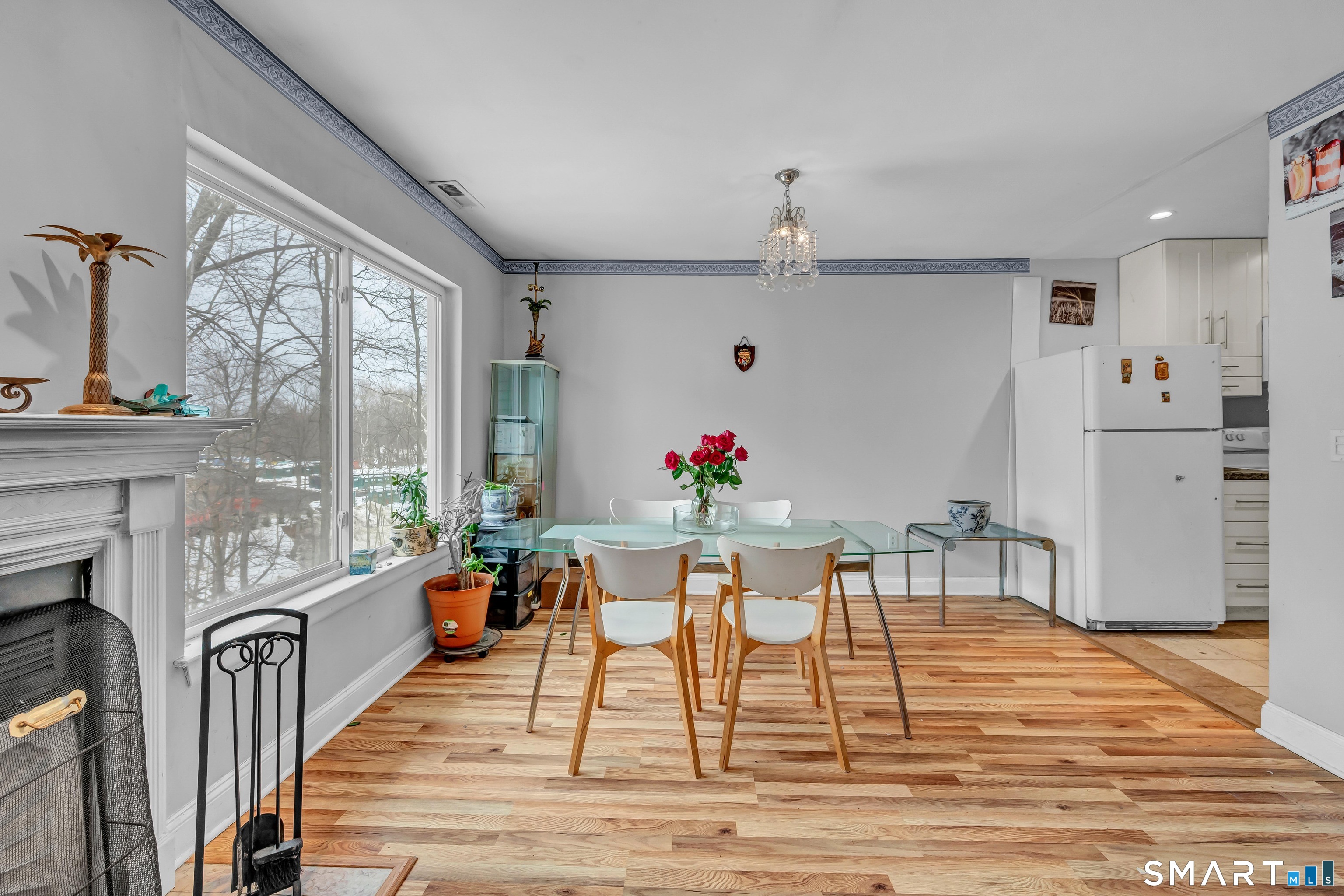 14 Newtown Road, Unit A5 Danbury, CT 06810 - Photo 5 of 27 a view of a dining room with furniture window and wooden floor