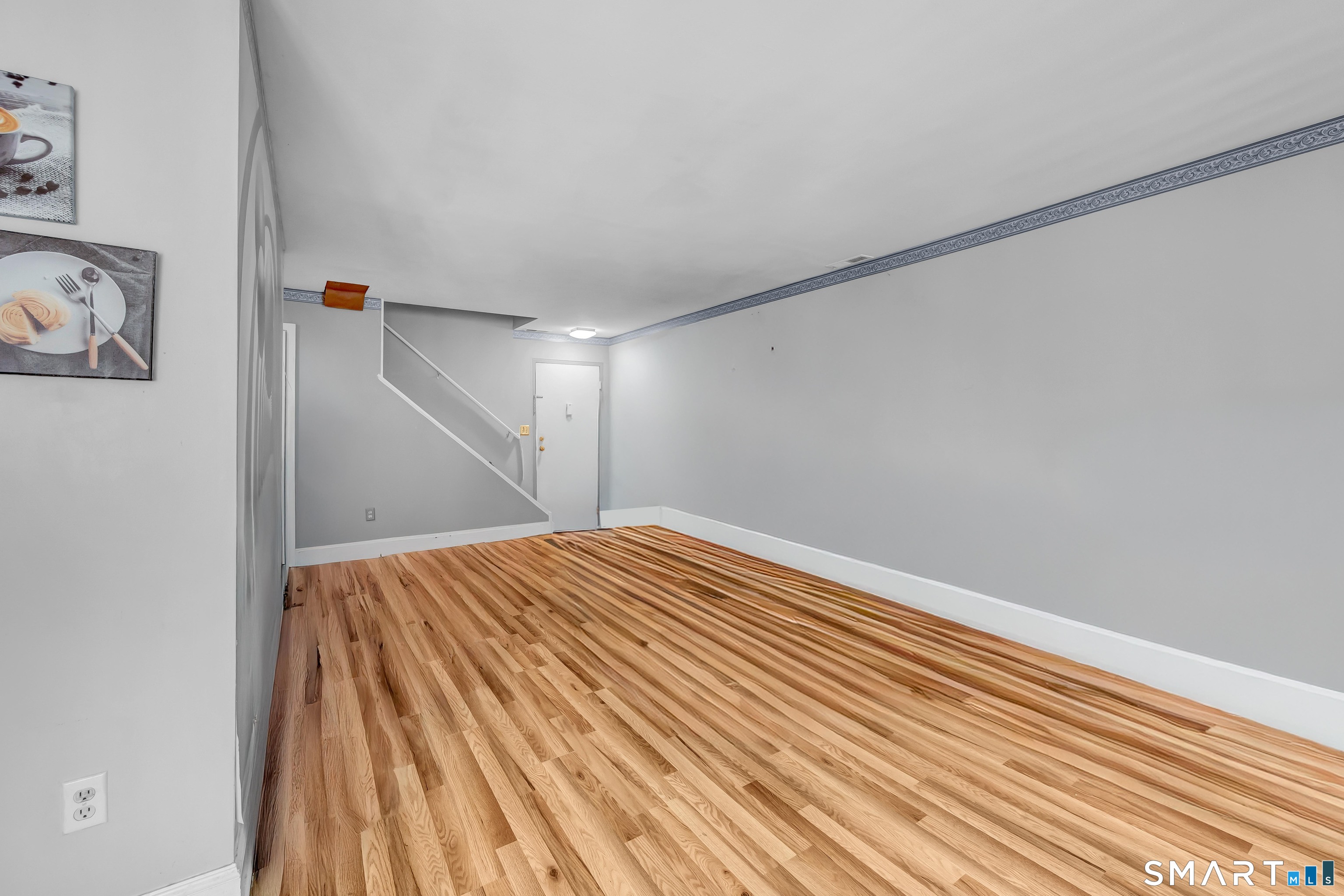 14 Newtown Road, Unit A5 Danbury, CT 06810 - Photo 7 of 27 a view of empty room with wooden floor
