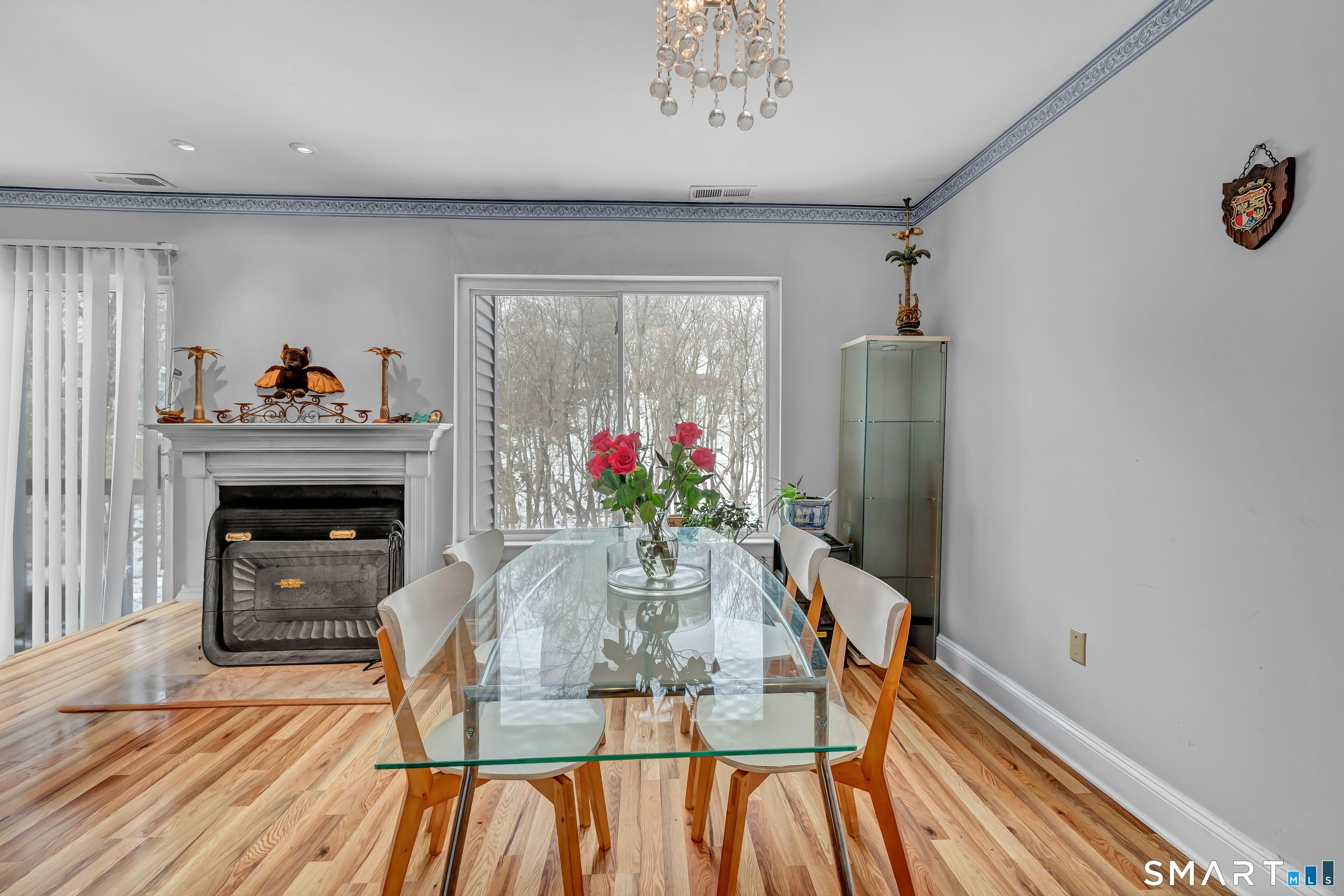 14 Newtown Road, Unit A5 Danbury, CT 06810 - Photo 10 of 27 a dining room with furniture potted plants and wooden floor