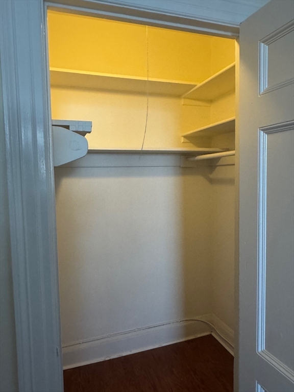 112 Pinckney Street, Unit 11 Boston, MA 02114 - Photo 7 of 16 a view of a room with wooden floor and windows