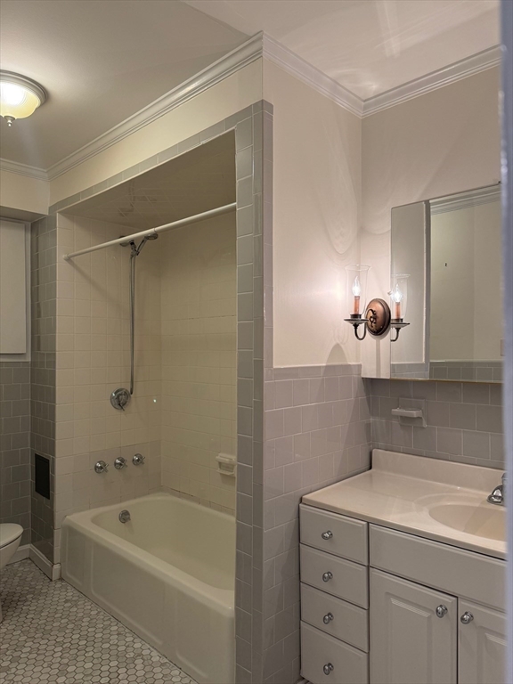 112 Pinckney Street, Unit 11 Boston, MA 02114 - Photo 10 of 16 a bathroom with a tub a sink and mirror